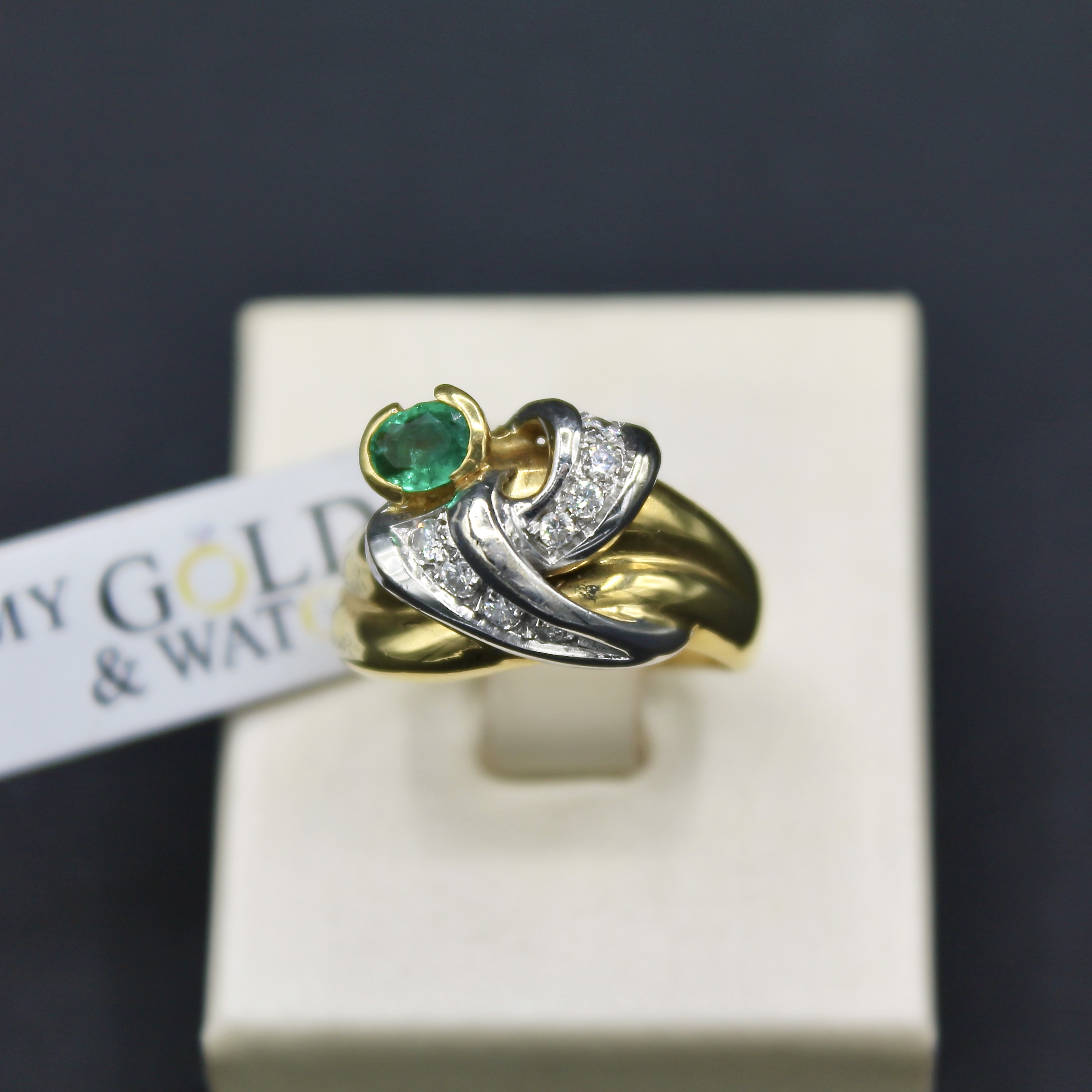 anello oro giallo e bianco 18k con smeraldo e diamanti