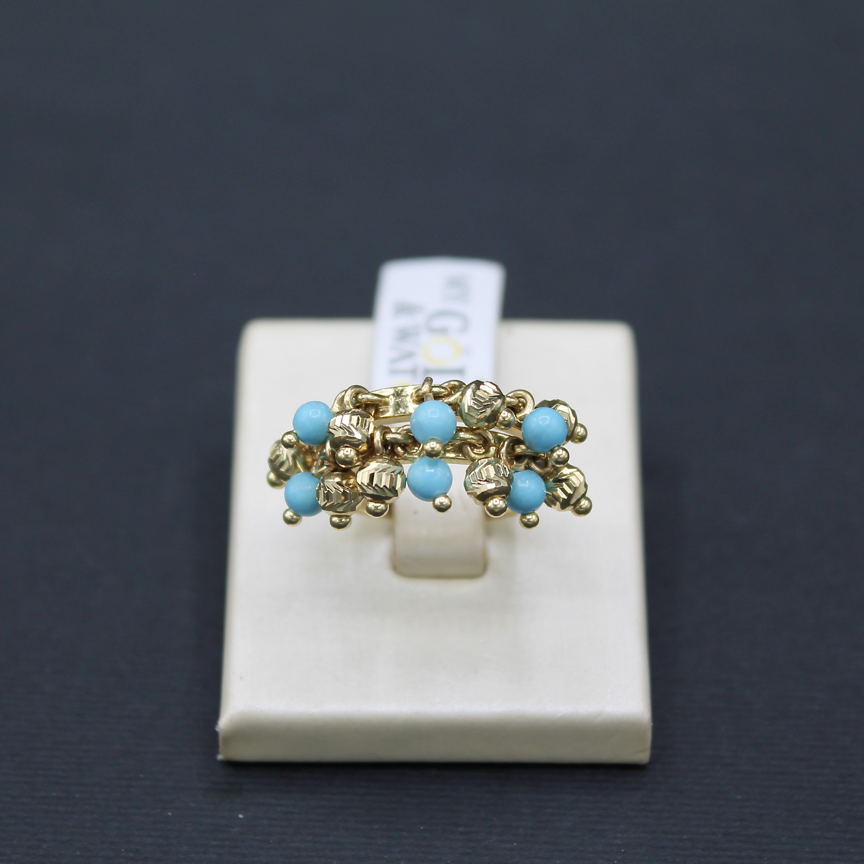 Anello in oro giallo 14k con turchesi