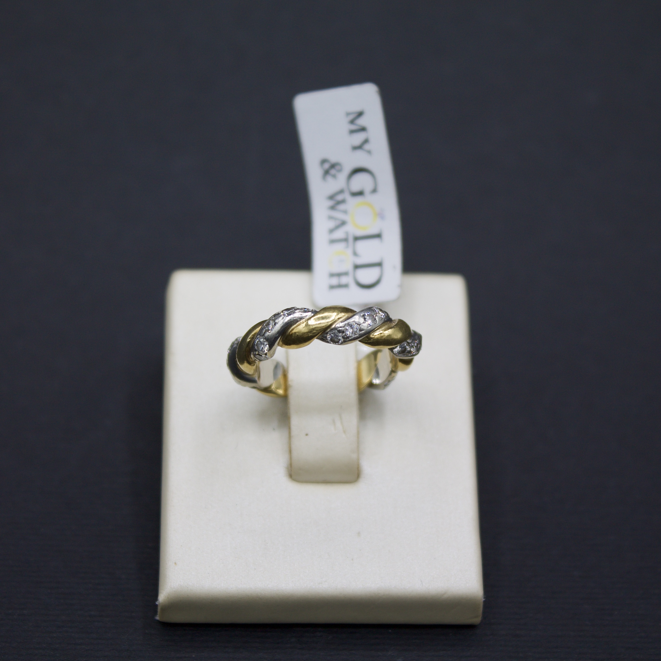 Anello intrecciato in oro bianco e giallo 18k con diamanti