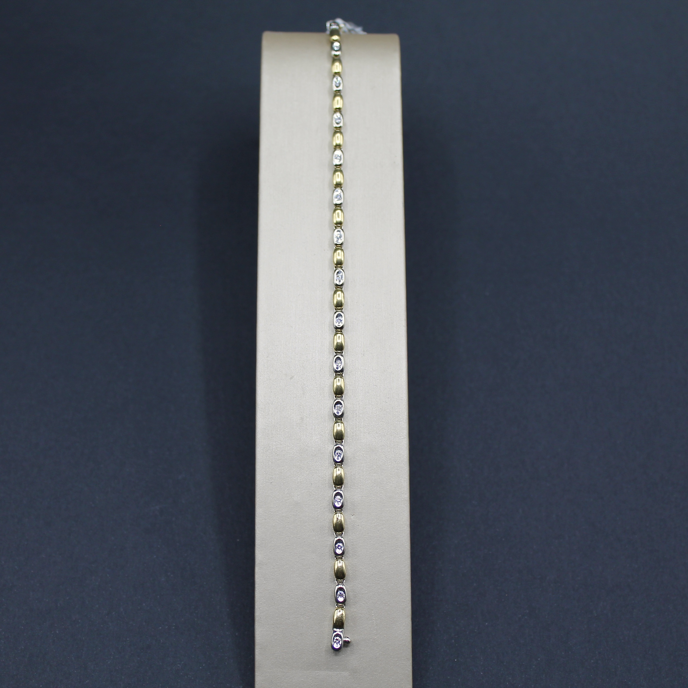 bracciale tennis in oro giallo e bianco oro 18k