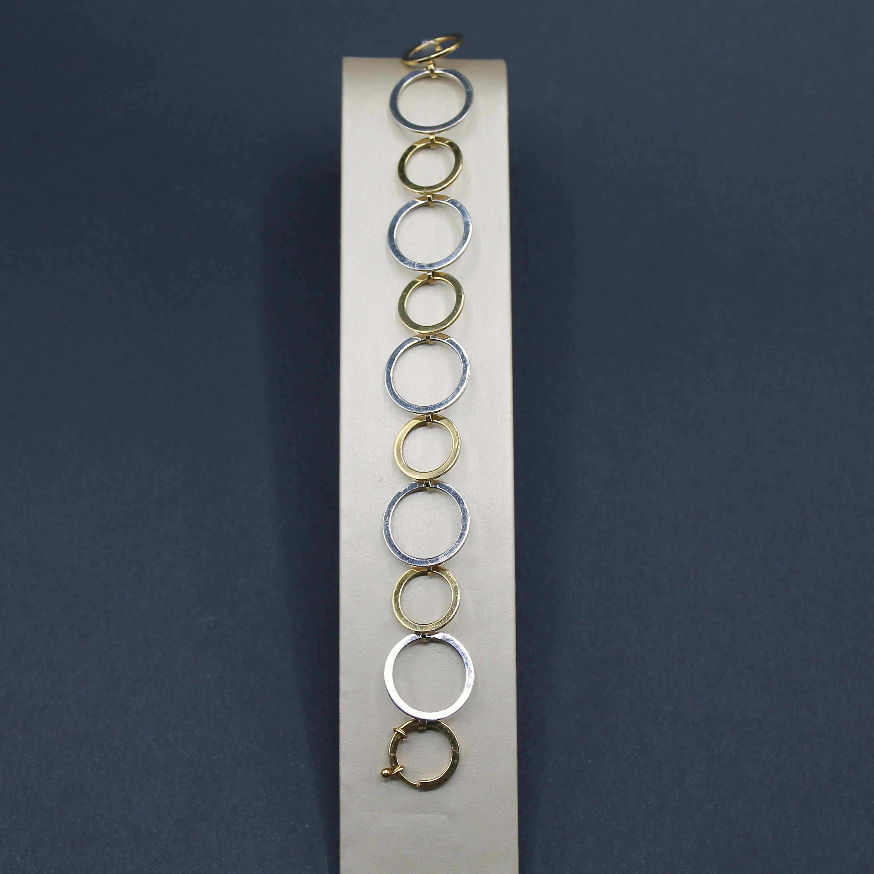 bracciale a cerchi in oro giallo e bianco 18k